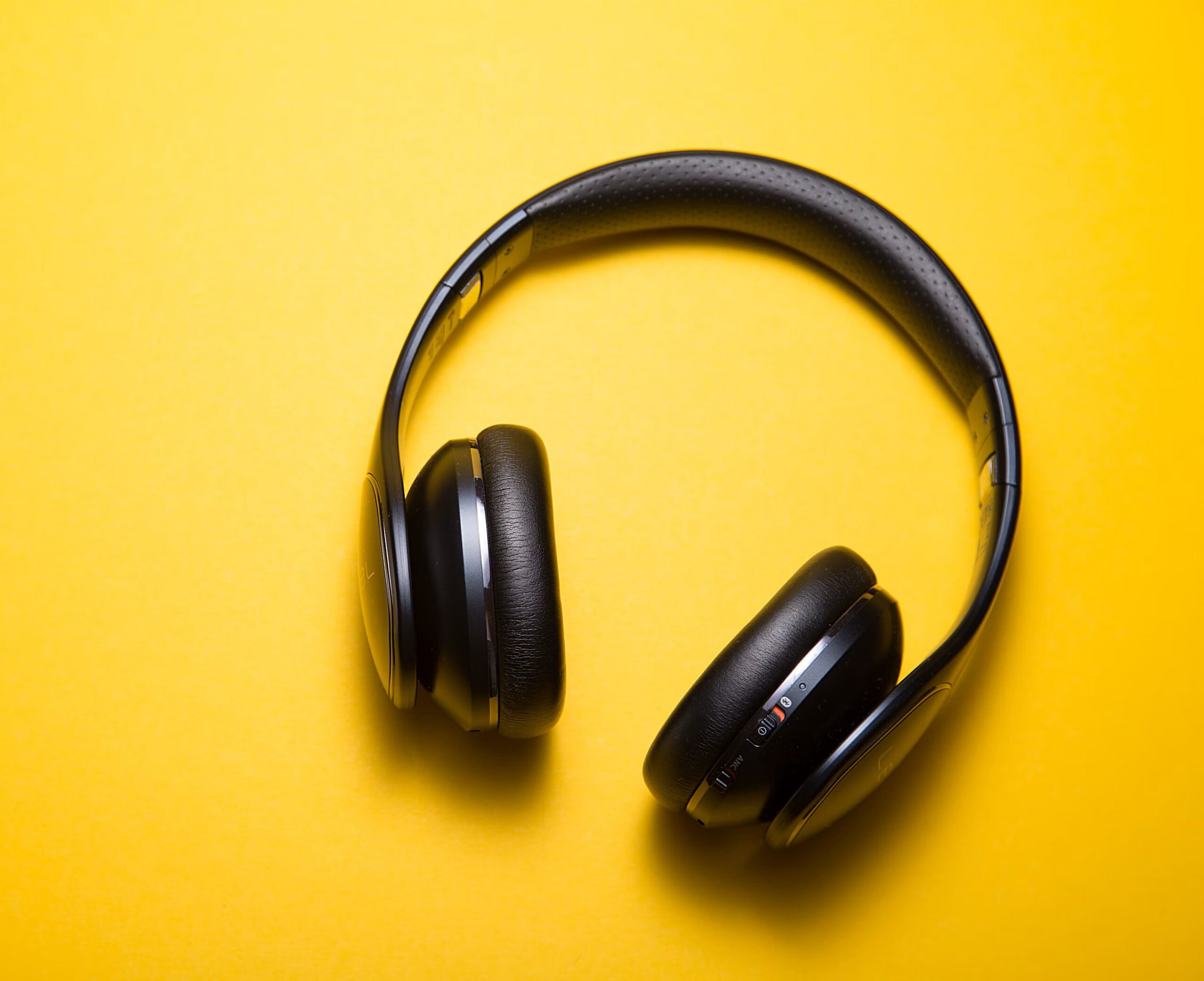 Headphones on yellow background